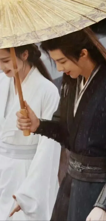 Asian couple in traditional attire under a bamboo umbrella.