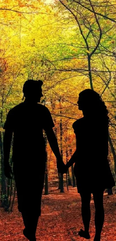 Silhouette of a couple in an autumn forest.