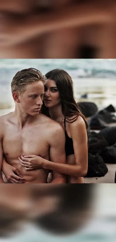 Romantic couple embracing on a scenic beach with ocean backdrop.