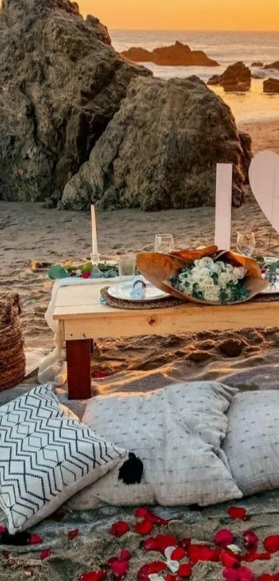 Romantic beach dinner setup with roses, candles, and sunset.