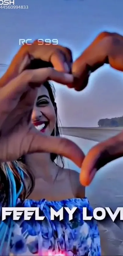 Hands forming heart shape with smiling woman at beach.