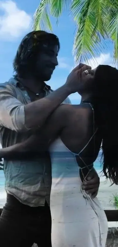 Couple embracing on a tropical beach under palm trees.