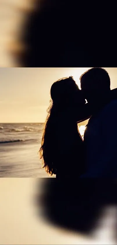 Silhouette of a couple kissing at sunset on the beach.