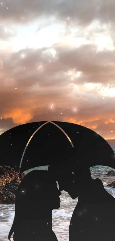 Silhouette of couple under umbrella at sunset beach.