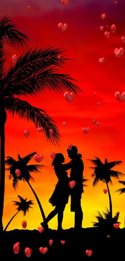 Silhouetted couple and palms at sunset on a beach.