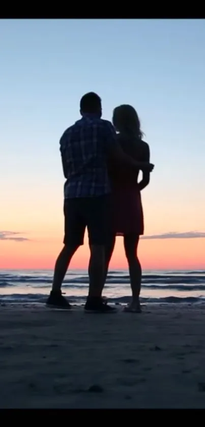 Couple silhouetted against a sunset beach scene, capturing romance and tranquility.