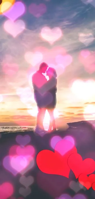 Couple embracing at sunset with heart bokeh overlay on a beach.