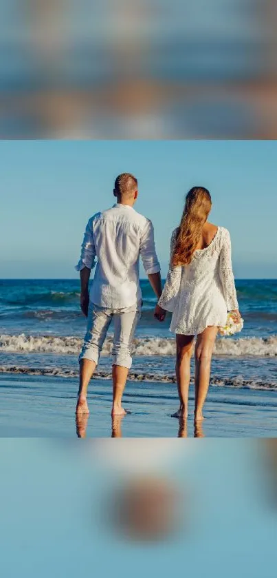 Romantic couple holding hands on a serene beach, ocean waves in the background.