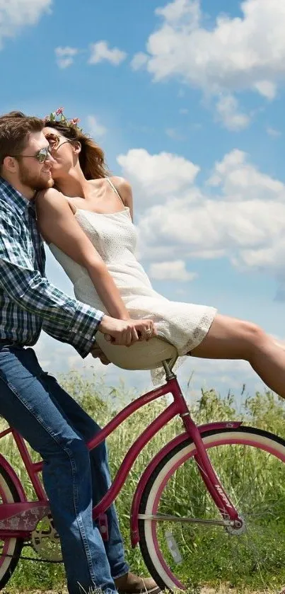 A couple in love rides a bicycle under a bright blue sky.