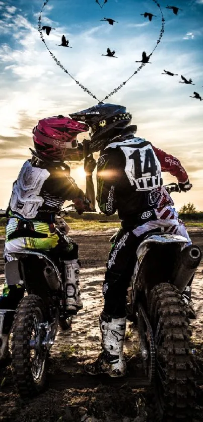 Bikers under a heart formation at sunset.