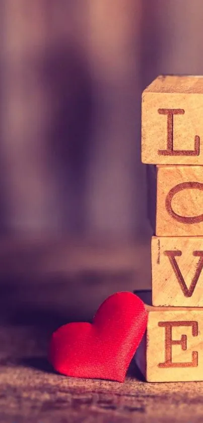 Romantic wallpaper with wooden blocks spelling 'LOVE' and a red heart.