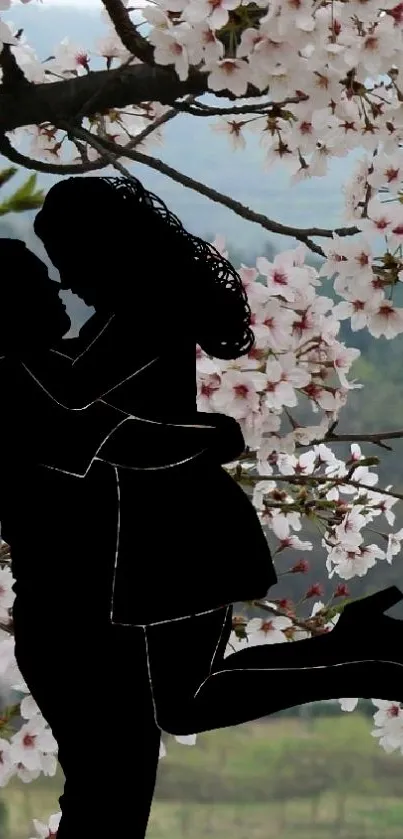 Silhouette of couple among cherry blossoms.