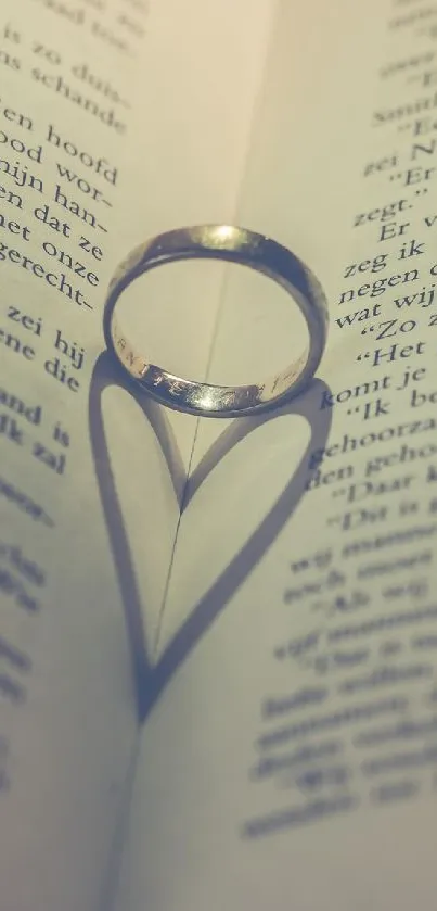 Ring cast heart shadow on book pages creating a romantic mobile wallpaper.