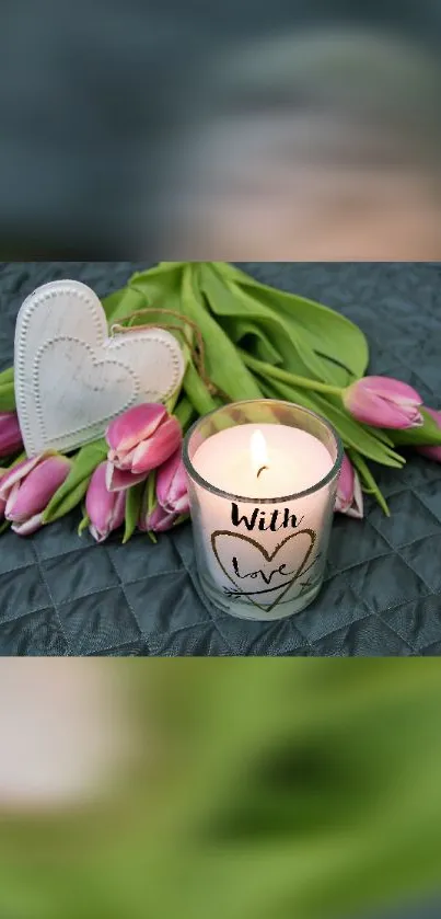 Candle with 'With Love' inscription and pink tulips arrangement.