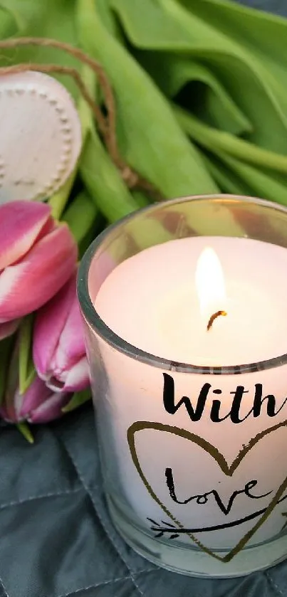 Romantic scene with a candle, pink tulips, and a heart on a quilt.