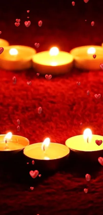 Romantic heart-shaped candle arrangement with red backdrop.