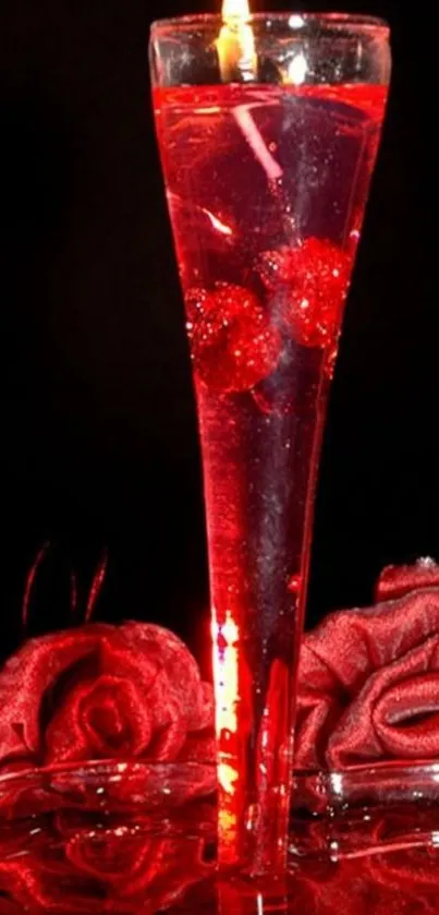 Romantic candle in glass with red glow and rose petals.