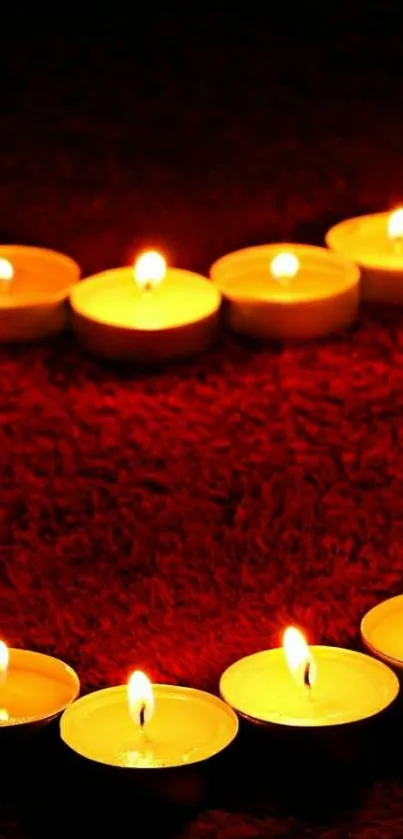 Heart shape formed by candles on a red background.