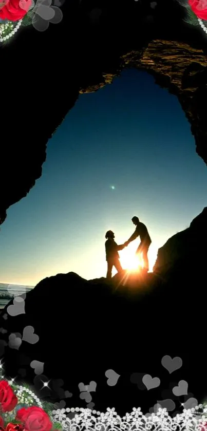 Silhouette of a couple in a cave with red rose border at sunset.