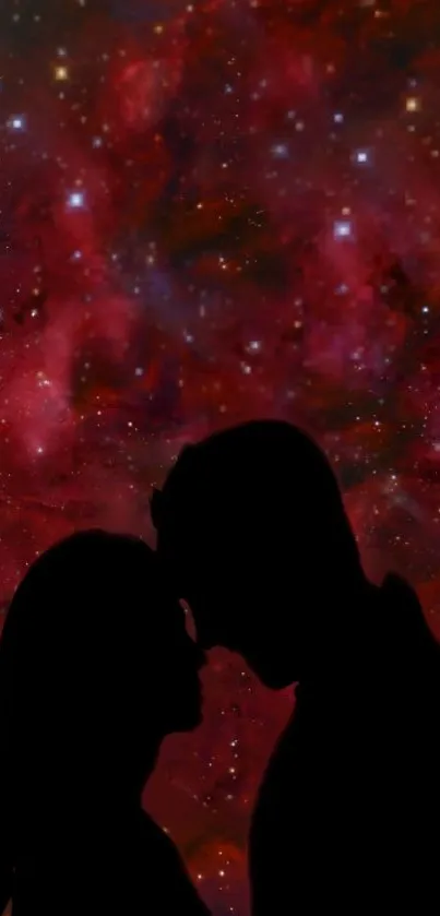 Silhouette of a couple against a cosmic, starry red background.