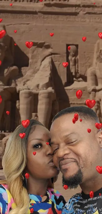 Couple sharing a kiss with an ancient temple and floating hearts background.