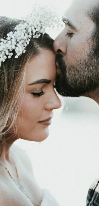 Romantic couple embracing with soft floral backdrop.