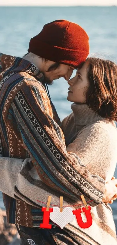 Romantic couple embracing by the sea with heart symbol.