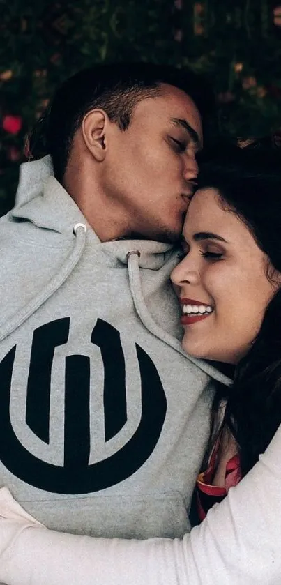 Romantic couple embracing warmly in a cozy setting.