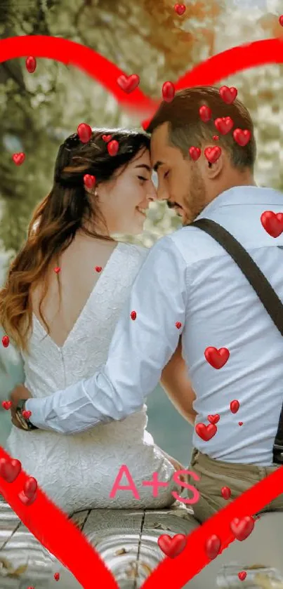 Romantic couple with red heart frame in a nature setting.