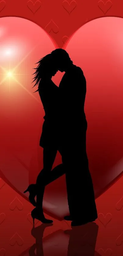 Silhouetted couple with red heart background, romantic and love-themed wallpaper.