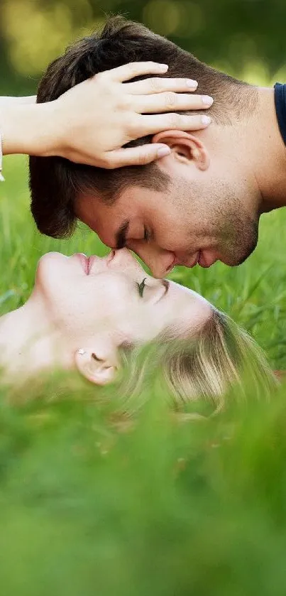 Romantic couple lying on green grass.