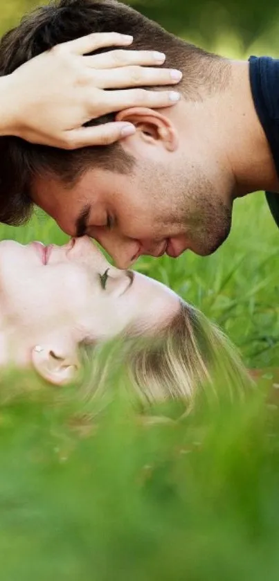 Romantic couple embracing in a green field.