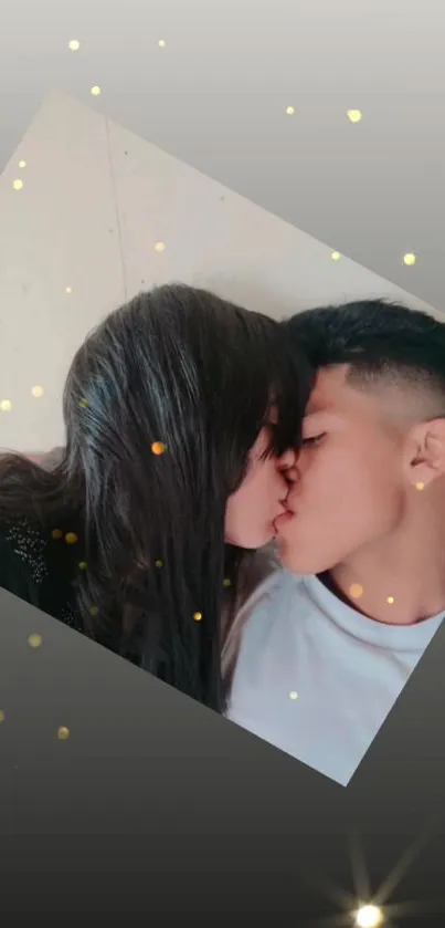 Kissing couple with sparkling lights and a dark gray background.