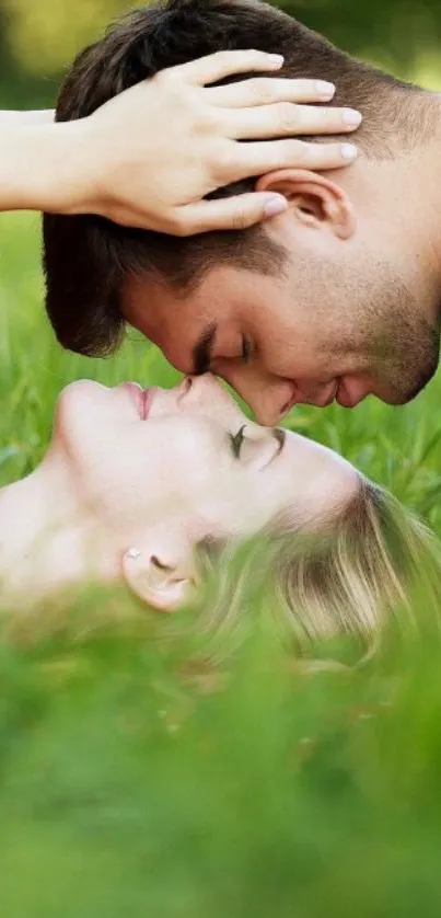 Romantic couple lying on grass, sharing a tender moment in nature.