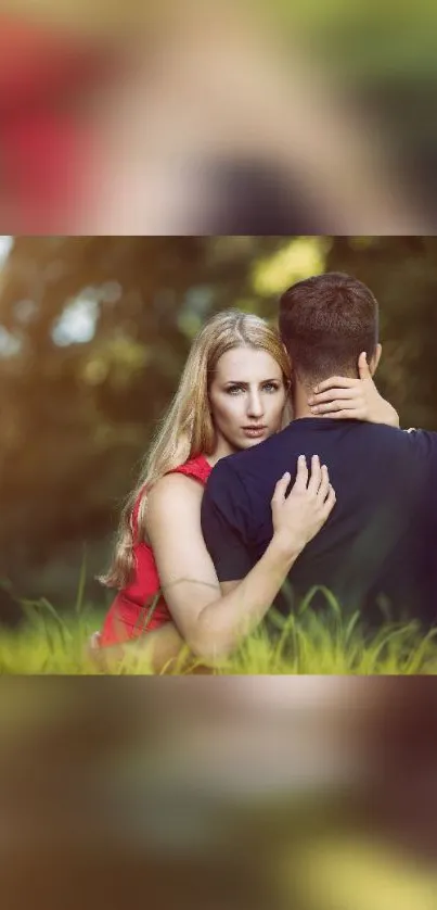 Romantic couple embracing in a lush, green outdoor setting.