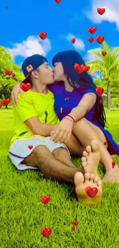 Couple sitting on green grass under a blue sky.