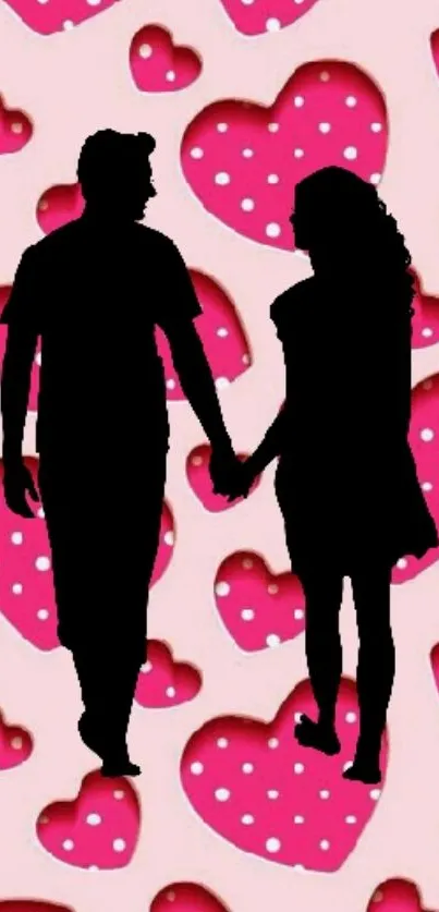 Silhouette of a couple holding hands, pink heart background.