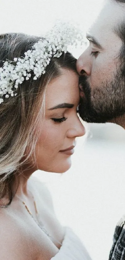 Romantic couple shares a tender moment outdoors with soft lighting.