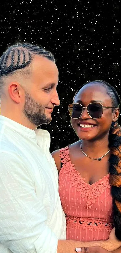 Smiling couple under a starry night sky, embracing warmly.