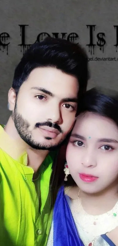 Romantic couple posing for a photo in vibrant attire.