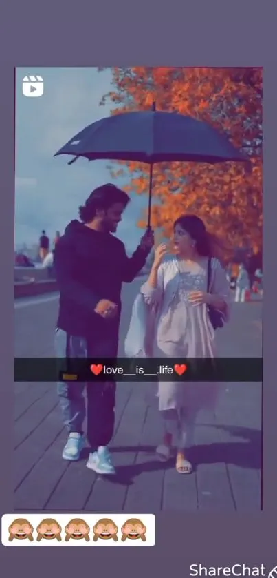 Couple walking under an umbrella with autumn leaves.