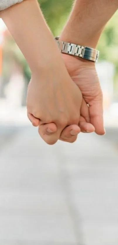 Couple holding hands in a serene outdoor setting, symbolizing love and connection.