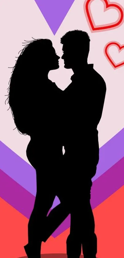 Silhouette of a couple with hearts on a colorful background.