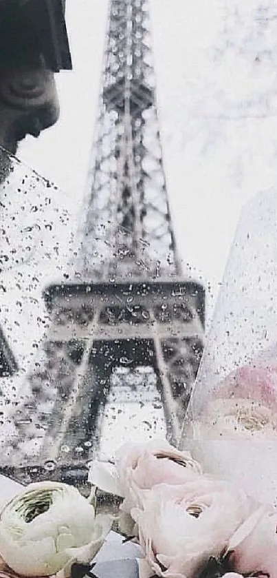 Blurred Eiffel Tower behind flowers and raindrops.