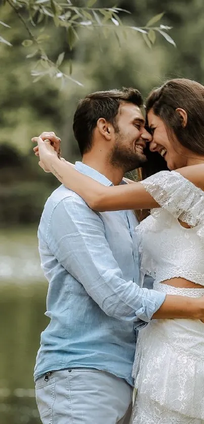 Romantic couple embracing by a tranquil lakeside, surrounded by trees and water.