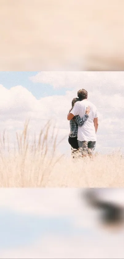 Couple embracing in a peaceful field under a cloudy sky, creating a romantic ambiance.