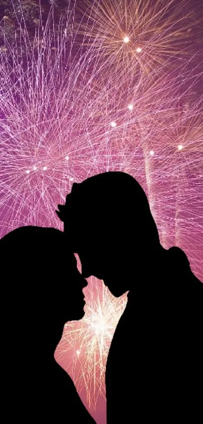 Silhouetted couple with fireworks in vibrant purple background.