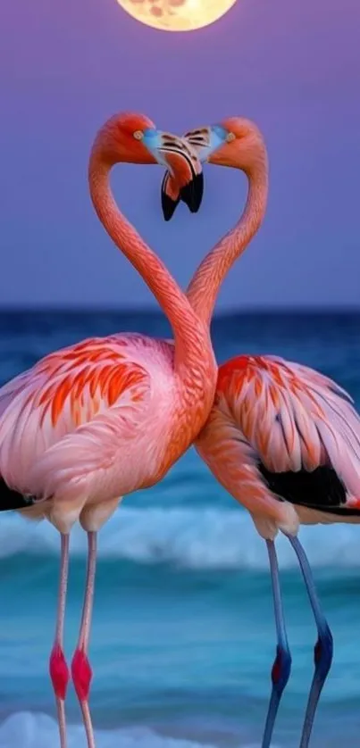 Two flamingos form a heart shape by the beach under a full moon.