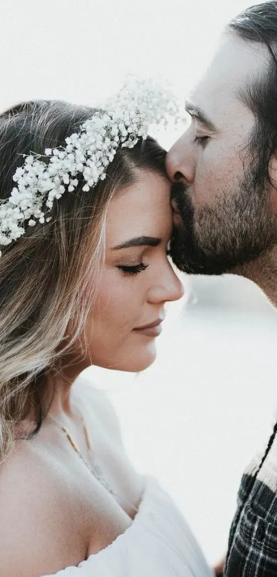 Romantic couple embracing with floral crown, simple background.