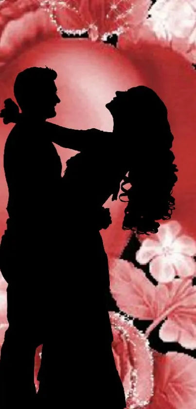 Silhouette of a couple on a red floral background wallpaper.